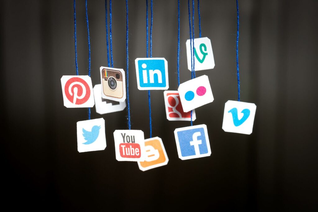 Social Media Icons Hanging On Strings | Growth99 | Website Development, Digital Marketing, SEO in USA